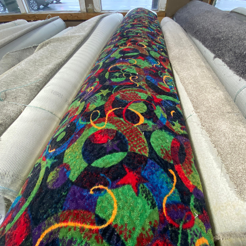 roll of brightly colored red, green, blue, yellow commercial carpet at Marion's in Portland oregon
