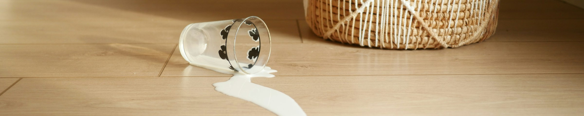 Waterproof floor with a spilled glass of milk