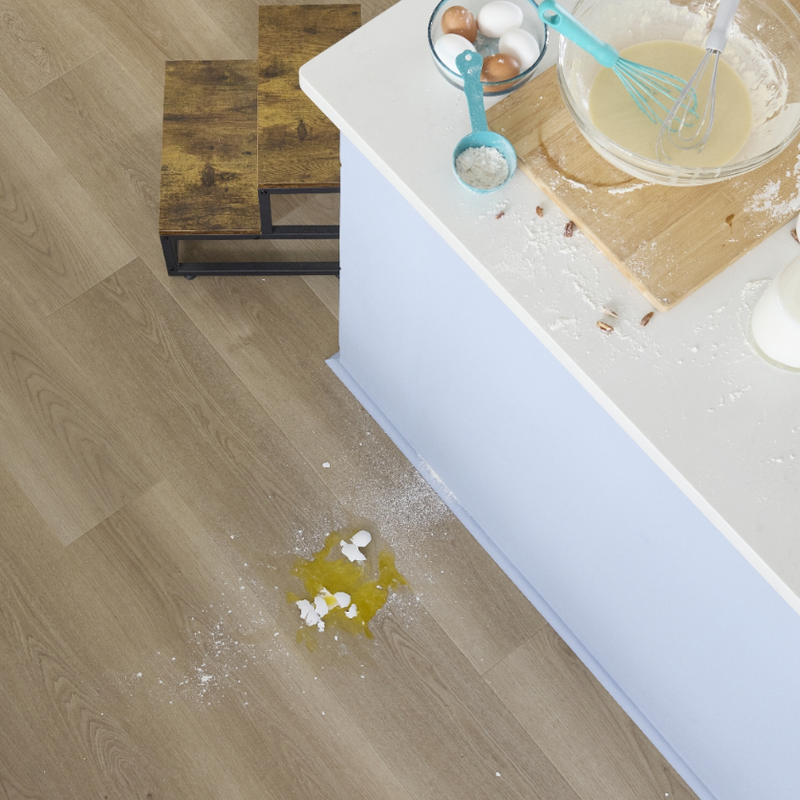 Baking on a countertop in a kitchen with waterproof flooring by Pergo