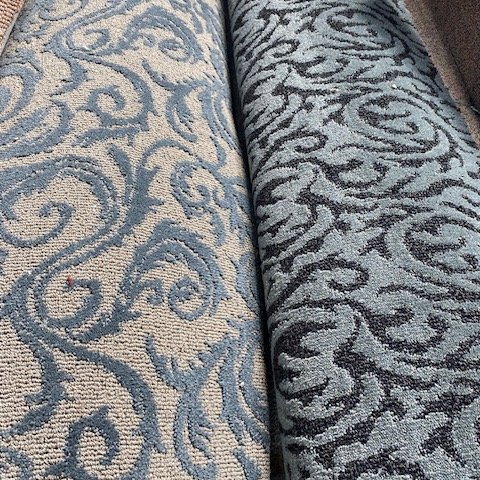 Blue floral carpet rolls at Marion's in Portland