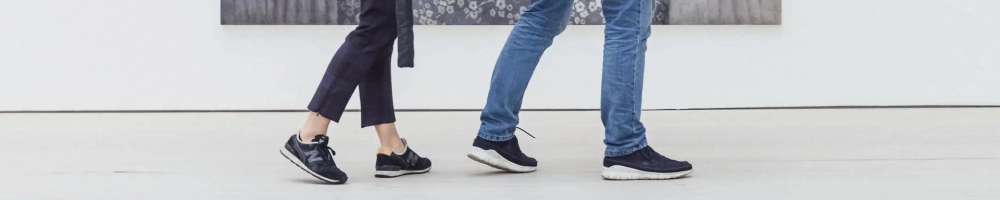 Customers walking across a white floor in a commercial building